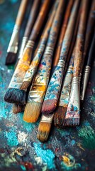 Fototapeta premium Set of Colorful Paintbrushes with Paint Stains on Artistic Surface for Creative Art Projects