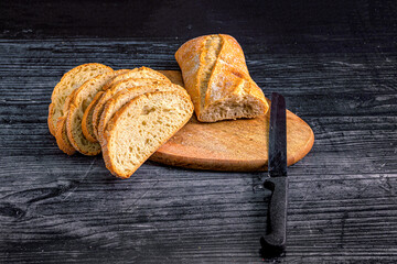 Fresh Rustic Bread Loaf with Slices and Knife