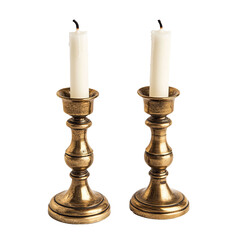 Two antique brass candle holders with white candles each candle slightly burnt