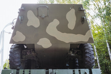 This image features the rear section of a military vehicle, which is designed with a distinct...
