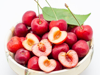 red sweet ripe cherry in the clay bowl close up