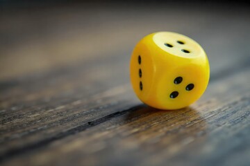 Close-up shot of a single yellow die rolling across a wooden surface, motion blurred, highlighting the vibrant color and textured surface of the die , vibrant, macro, betting