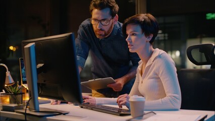 Business woman man in night office crypto online computer trading cooperation businessman...