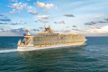 Aerial view of large cruise liner departing into Atlantic ocean from Miami port. Florida travel...