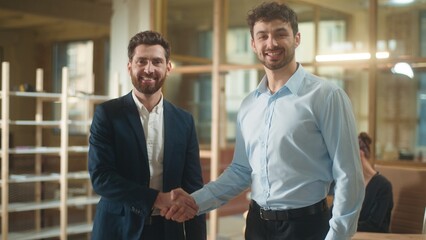 Business men shaking hands handshake in office two smiling businessmen shake arms guys agreement...