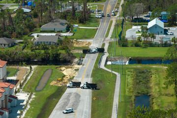 Roadblock at damaged road bridge destroyed by river after flood water washed away asphalt....