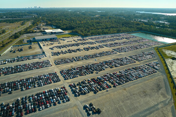 View from above of big parking lot with parked used cars after accident ready for sale. Auction...