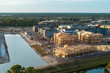 Wooden frames of new Florida apartment condos under construction. Development of residential...
