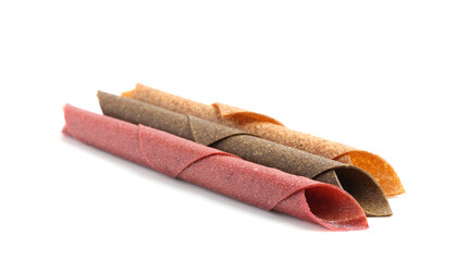 Delicious fruit leather rolls on white background