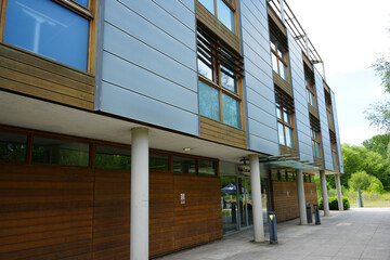 Nottingham, England - June 20 2025: Modern university building with a clean, contemporary design and cylindrical white columns.