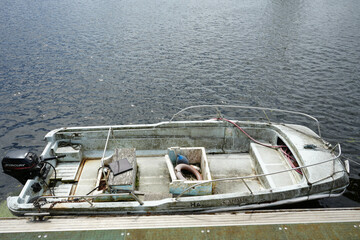 Nottingham, England - June 20 2025: Old weathered motorboat docked on River Trent with signs of...
