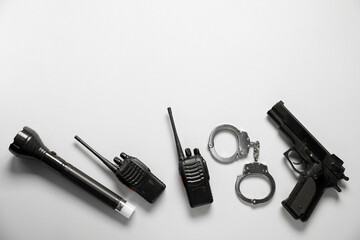 Different police equipment on white background, flat lay. Space for text
