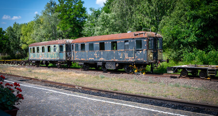 Rusted railway passenger cars on siding