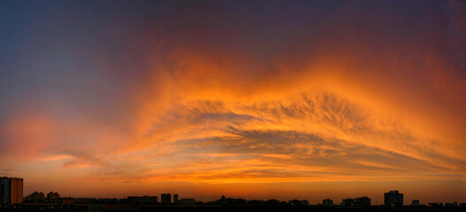 Wide panorama of the sunset, The sky is on fire. Kiss lips shape from clouds. Original form of smoke. Giant idea for banner.