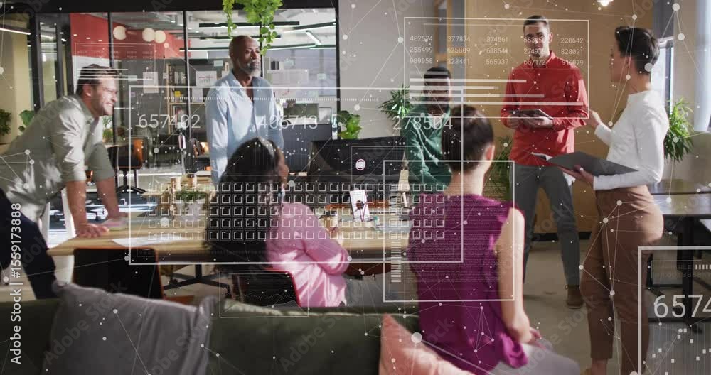 Poster presenter swiping tablet and updating holographic charts while team analyzing business metrics