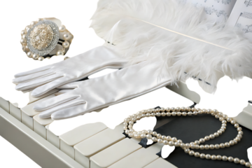 White gloves and pearls on a piano keyboard still