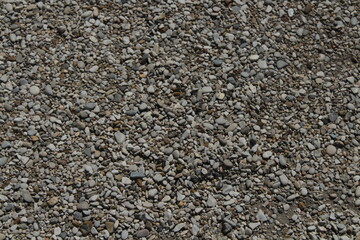 rocks and stones and pebbles texture. smooth pebbles background. variety of smooth, natural rocks with different shapes and textures. Processed collage of sea shore pebbles texture. 
