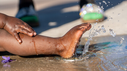 Water provides cool relief from the summer heat as it rushes past the toes 