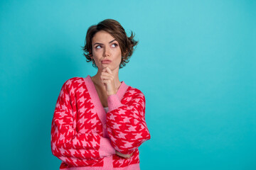 Photo portrait of pretty young girl look skeptical empty space wear trendy red outfit isolated on...