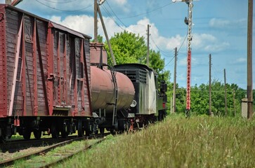 old train in the countryside. view of an old steam locomotive in the countryside going into the distance