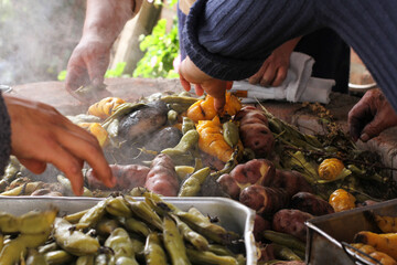 photography of traditional Peruvian food called Pachamanca. Food concept.