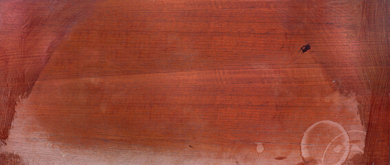 Aged mahogany wood surface with natural texture and weathered appearance