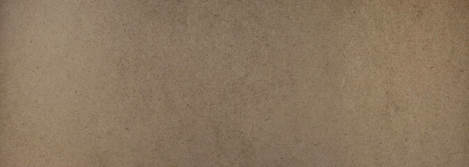 Close-up texture of smooth brown recycled cardboard surface