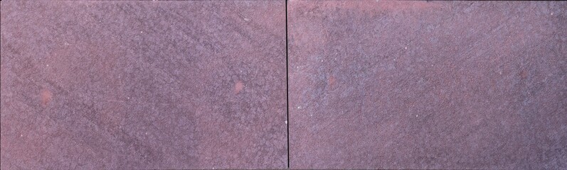 Purple stone tiles with rough texture and rectangular pattern on exterior wall
