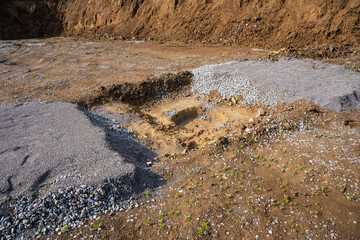 Plate load test results visible on soil surface after static pressure application. Ground...