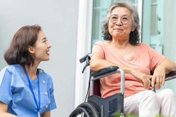 A female caregiver provides compassionate, patient-centric support to a senior woman. Concept for...