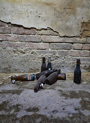 Picture of a lost place with an old jar and bottles in the foreground