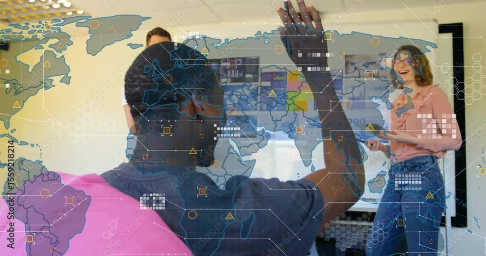 Poster seated man raising hand on charts activating transparent map causing tech team gesturing, smiling