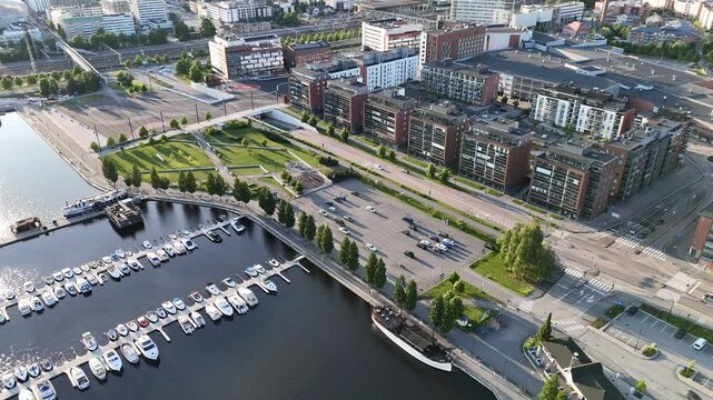 Tranquil Sunset Dolly Shot of Jyv&auml;skyl&auml; Harbor and Lutakko in Summer Evening