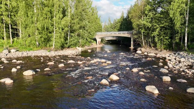 Tranquil Summer Evening on Rewilded River Tourujoki in Jyv&auml;skyl&auml; - Serene Water Flow at Sunset
