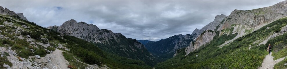 Panoramic view of Logarska dolina valley with peaks of Slovenian Alps covered by passing clouds. © Semi