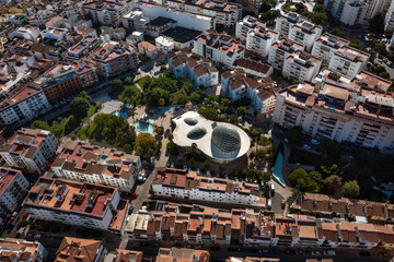 An expansive aerial view of Estepona, showing its dense urban sprawl leading to the extensive...