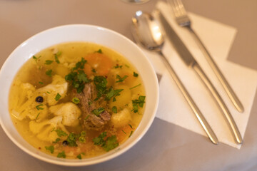 lunch chicken broth with noodles in a plate