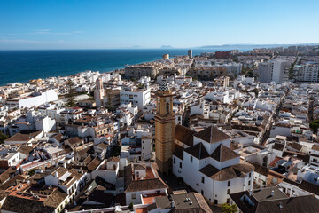 Aerial view of Estepona's charming old town, featuring a prominent church spire amidst white...