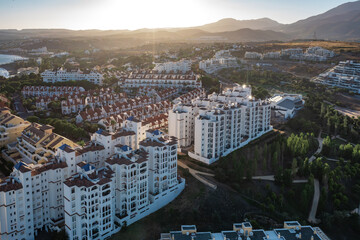 Aerial view of a large urban park in Estepona, surrounded by residential buildings and overlooking...