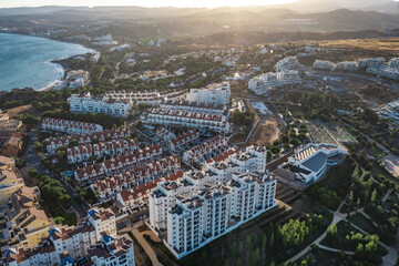 Aerial view of a large urban park in Estepona, surrounded by residential buildings and overlooking...