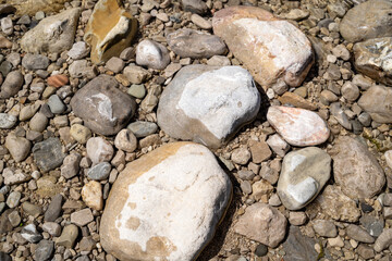 River stones and pebbles – natural rock texture background