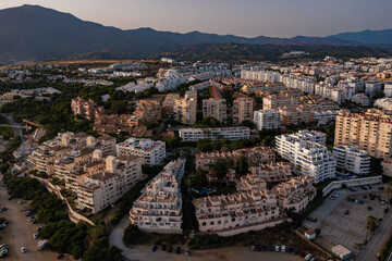 Aerial view of a large urban park in Estepona, surrounded by residential buildings and overlooking...