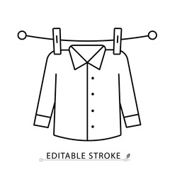 A drying shirt icon in minimalist style with editable stroke. Laundry element, hanging clothes, clothing care, clean garment, household task, fabric drying, outline object, vector line illustration.