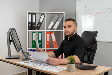 Business man analysys financial report chart data in office