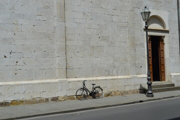 old bicycle in front of a wall
