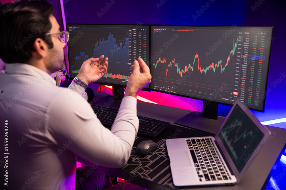 Poster smart trader businessman concentrating on dynamic stock exchange investment on pc and laptop showing