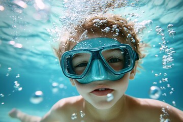 Naklejka premium Bright underwater atmosphere shows a child wearing goggles, playfully swimming and creating bubbles. The joyful energy is evident as the child interacts with water in a pool