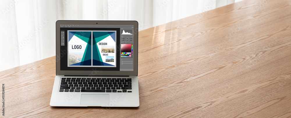 Poster graphic designer software for modern design of web page and commercial ads showing on the computer s