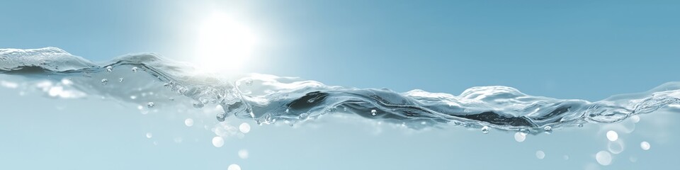 Close-up of sunlit water waves against blue sky background