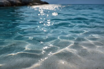Fototapeta premium Crystal clear turquoise ocean waves sparkling in the sunlight